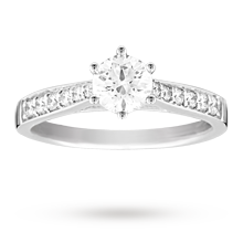 Canadian Ice brilliant cut 0.65 total carat weight solitaire and diamond set shoulders ring set in 18 carat white gold